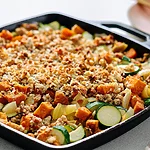 Ground Turkey and Sweet Potato Bake with Crispy Parmesan Cast iron skillet filled with ground turkey, sweet potatoes, and zucchini under a toasted parmesan panko crust