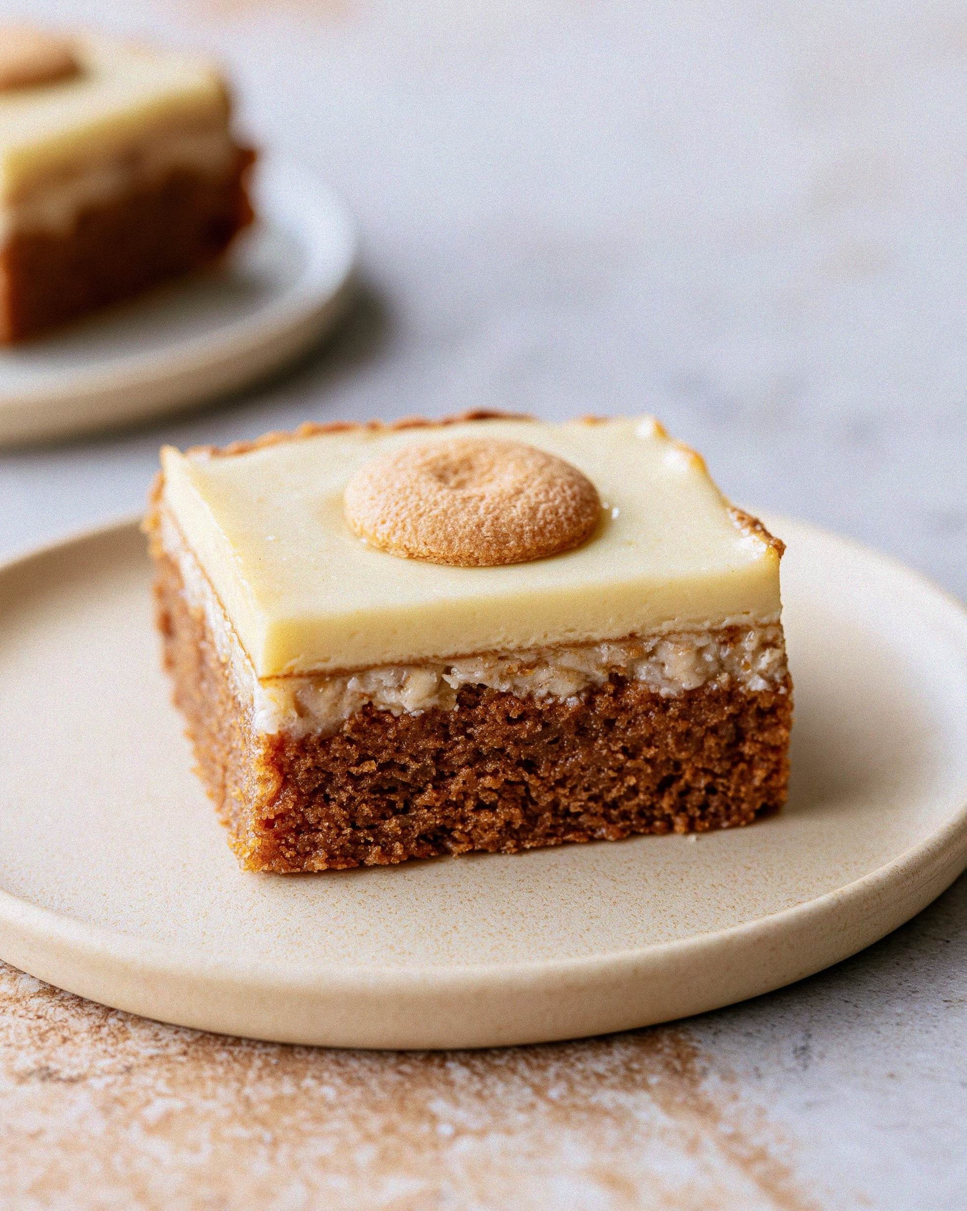 Square slice of browned butter banana pudding blondie with clear fudgy and creamy layers on a plate