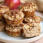 Apple Cinnamon Cottage Cheese Bites with a Bakery Crunch Apple cinnamon cottage cheese bites served on a white plate showing browned edges and soft centers