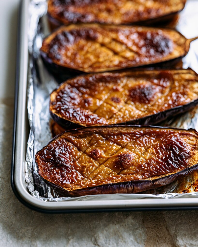 Broiled eggplant halves with a shiny, browned, and bubbling miso glaze