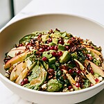 Honeycrisp Apple and Feta Salad Honeycrisp apple and feta salad ready to serve in a wide bowl with avocado, pomegranate, and crunchy nuts
