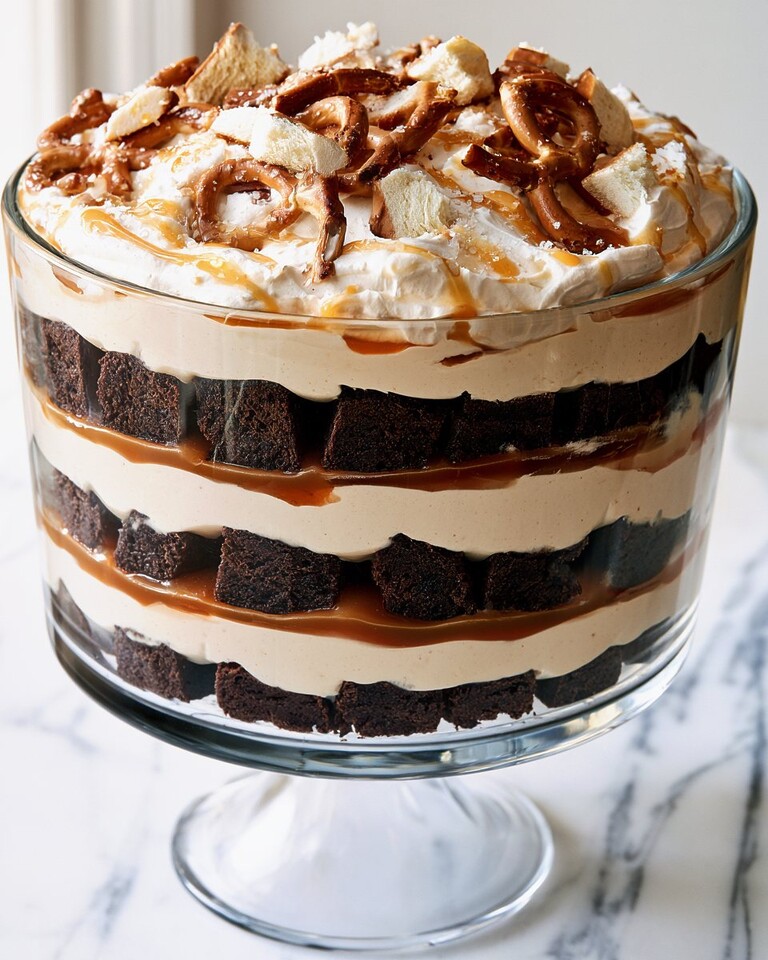 Make-Ahead Salted Caramel Brownie Trifle Salted caramel brownie trifle with layers of cheesecake mousse and crushed pretzels
