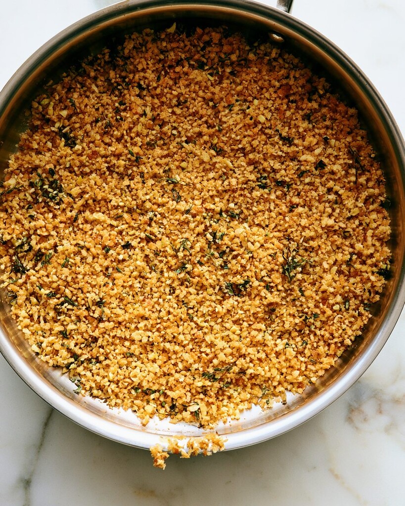 Golden toasted panko breadcrumbs, minced garlic, and thyme in a small skillet