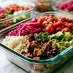 Sheet-Pan Vegan Burrito Bowls with Cauliflower Rice Vegan burrito bowl layered with roasted tofu, cauliflower rice, red cabbage slaw, salsa, and avocado in a glass container