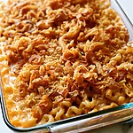 Crispy Onion Mac & Cheese Meatloaf in a Single Pan Baked mac and cheese meatloaf casserole with a golden brown crispy onion and panko topping in a glass pan