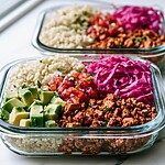 Two assembled vegan burrito bowls in glass containers, viewed from above, highlighting the brightly colored toppings